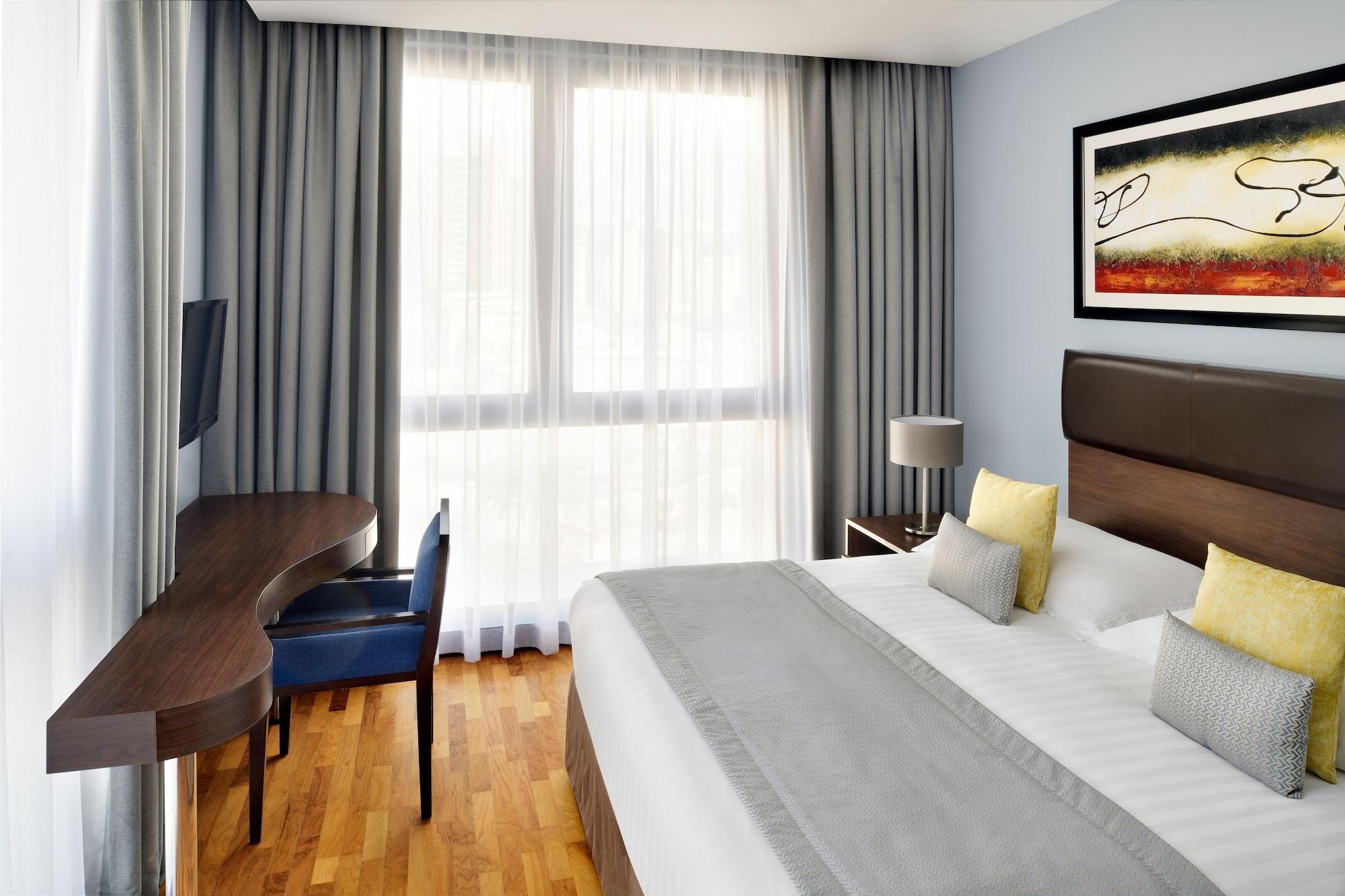 Mövenpick Hotel Apartments Al Mamzar Dubai Exterior foto A typical room at the hotel