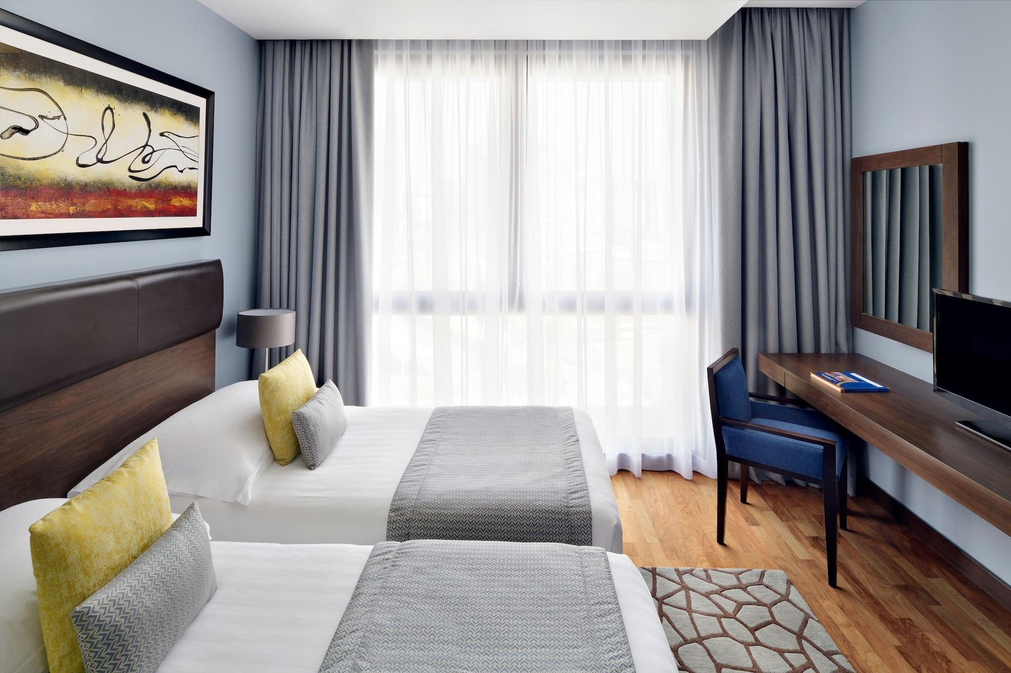 Mövenpick Hotel Apartments Al Mamzar Dubai Exterior foto A room at the hotel