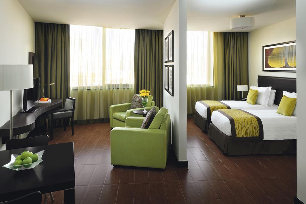 Mövenpick Hotel Apartments Al Mamzar Dubai Exterior foto A typical room at the hotel